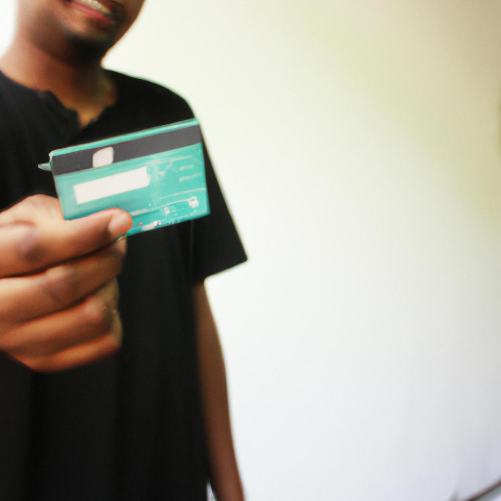 Person holding credit card, explaining