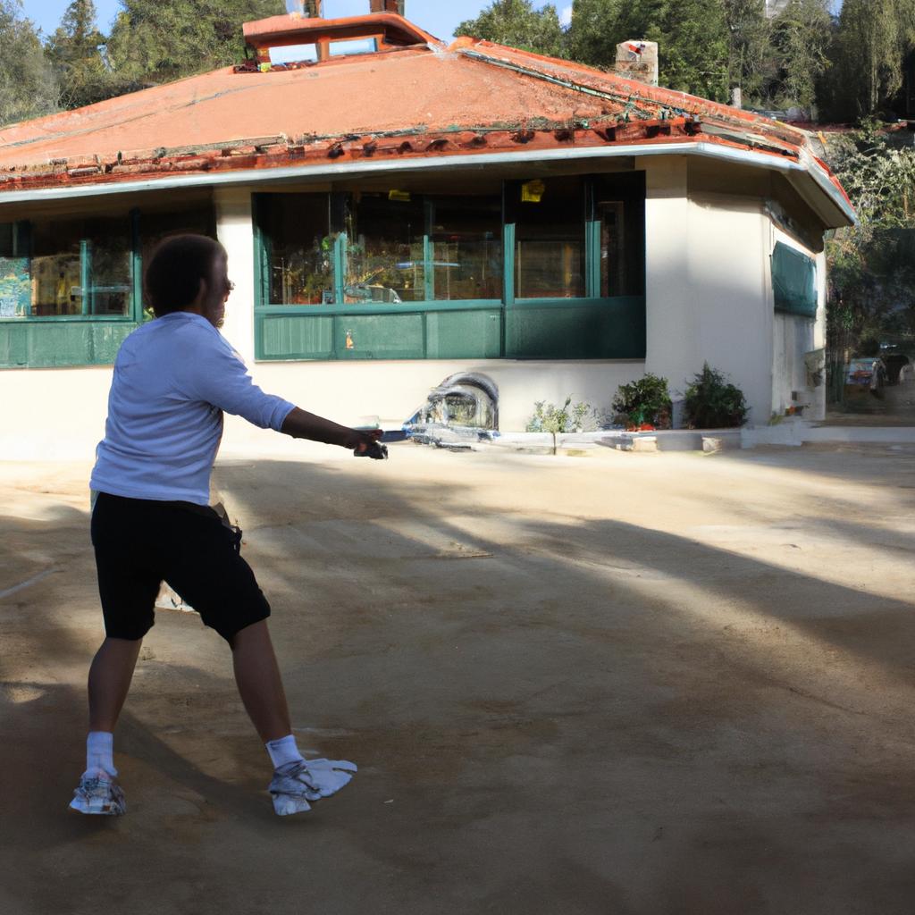 Person playing tennis at lodge